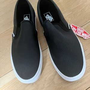 Vans Black and White Slip-On Sneakers